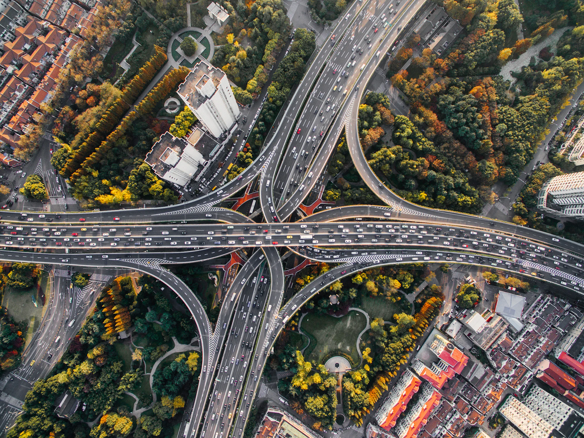 Placeholder aerial photograph of a road interchange threading through trees