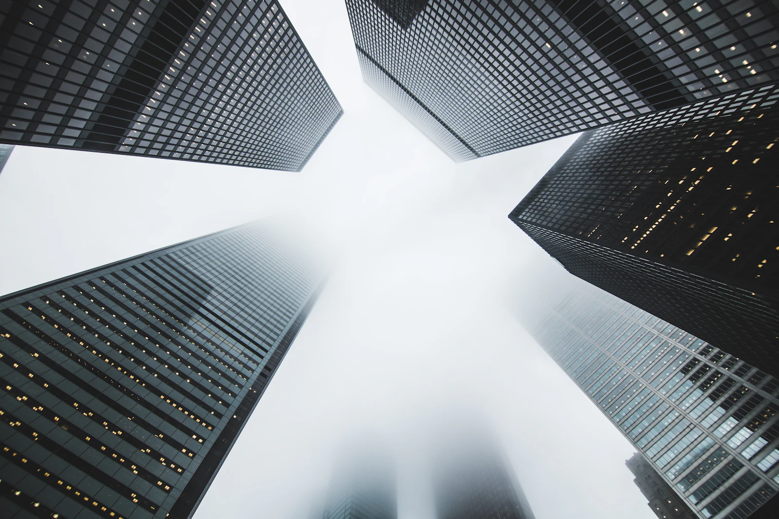 Placeholder photograph of towers disappearing into fog