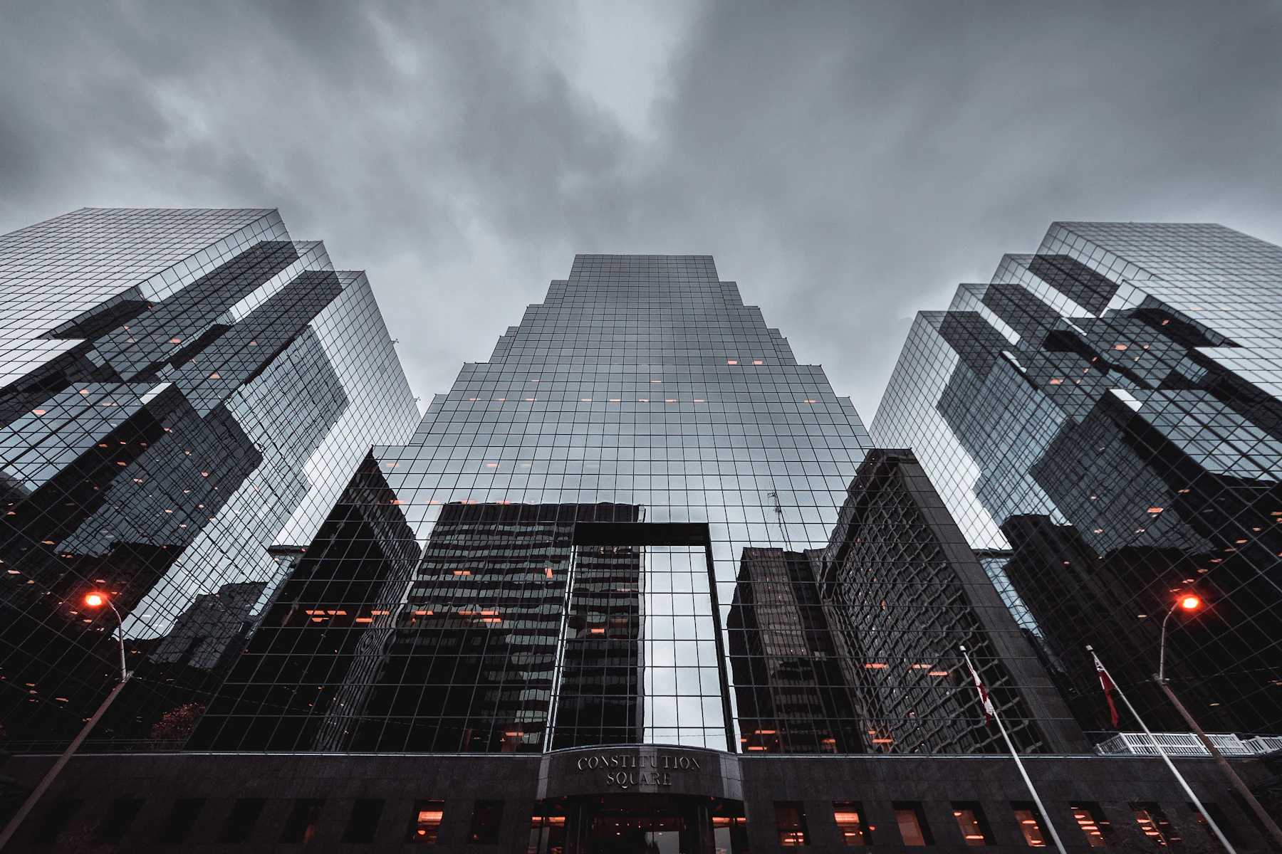 Placeholder photograph looking up at tall towers