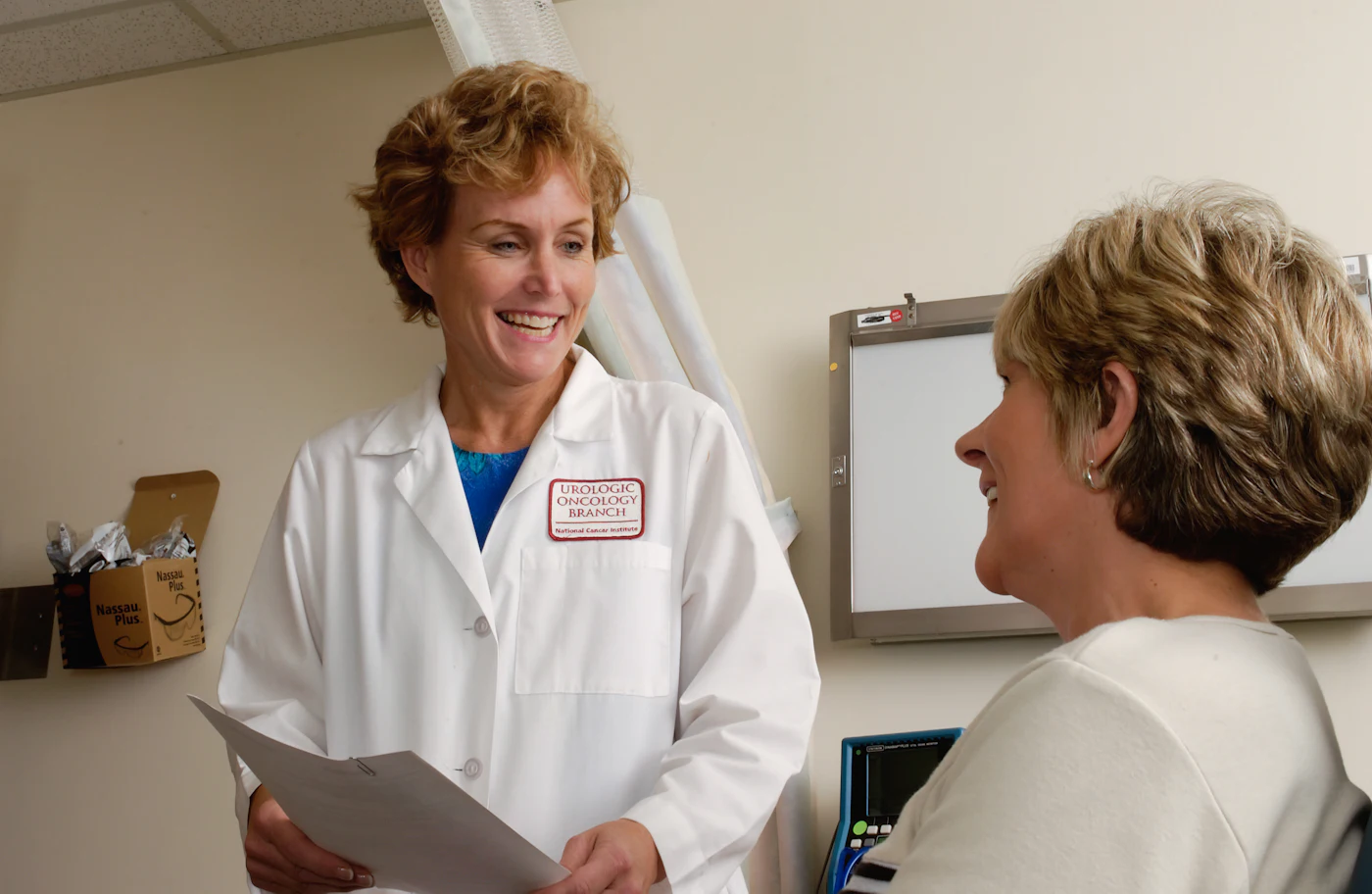 Placeholder photograph of a dentist talking with a patient