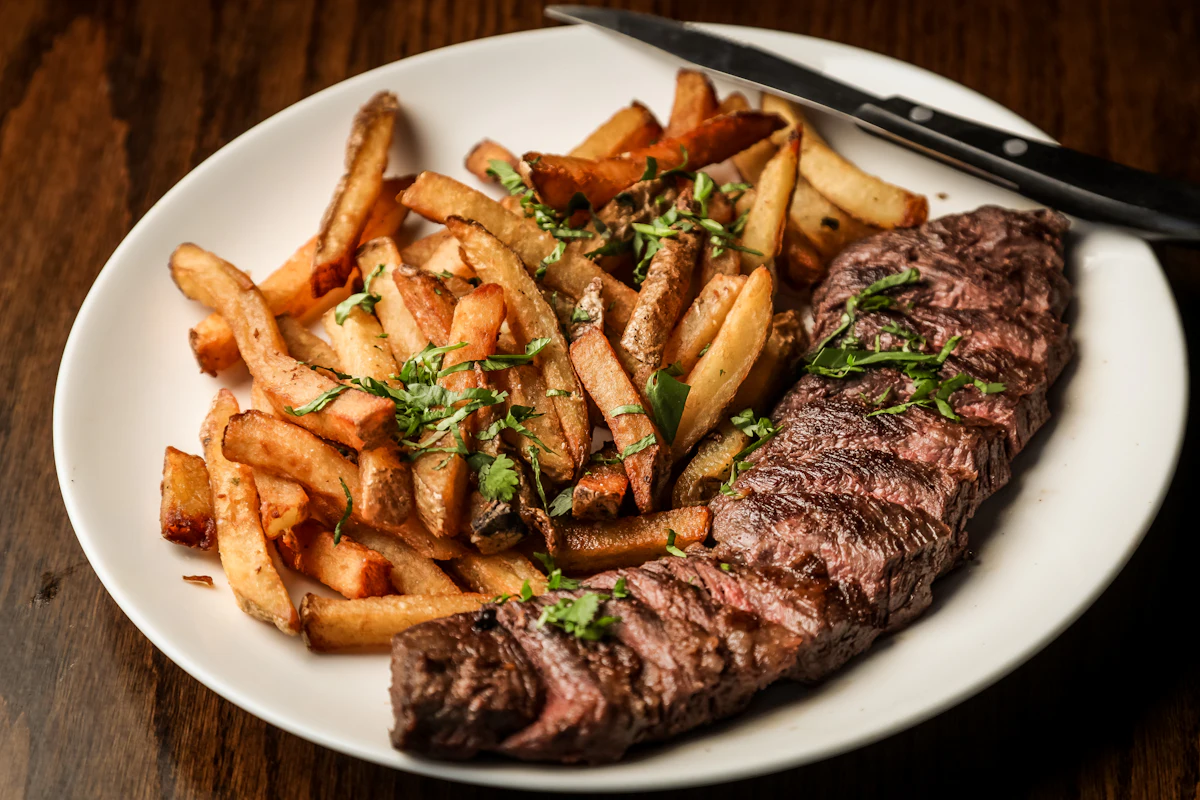 Placeholder photograph of steak and fries